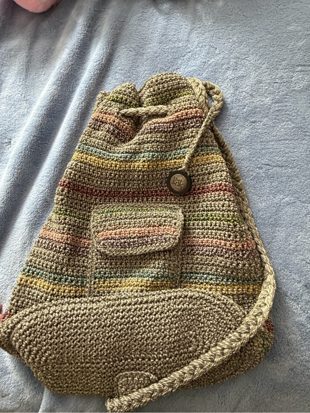 The Sak Multicolor Crochet Drawstring Backpack in Tan and Pastel Stripes